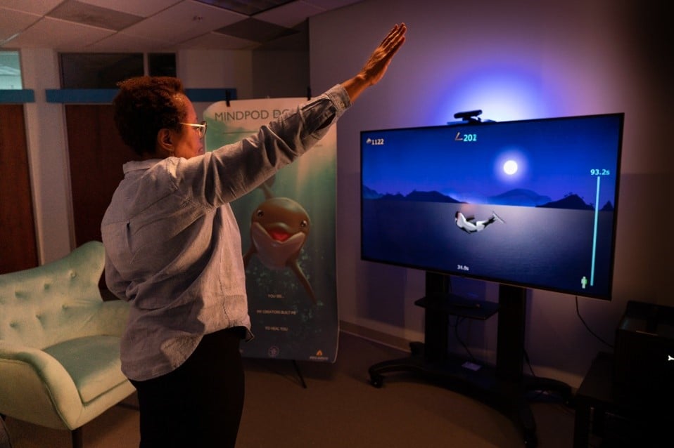 Patient working with MindMaze's solution